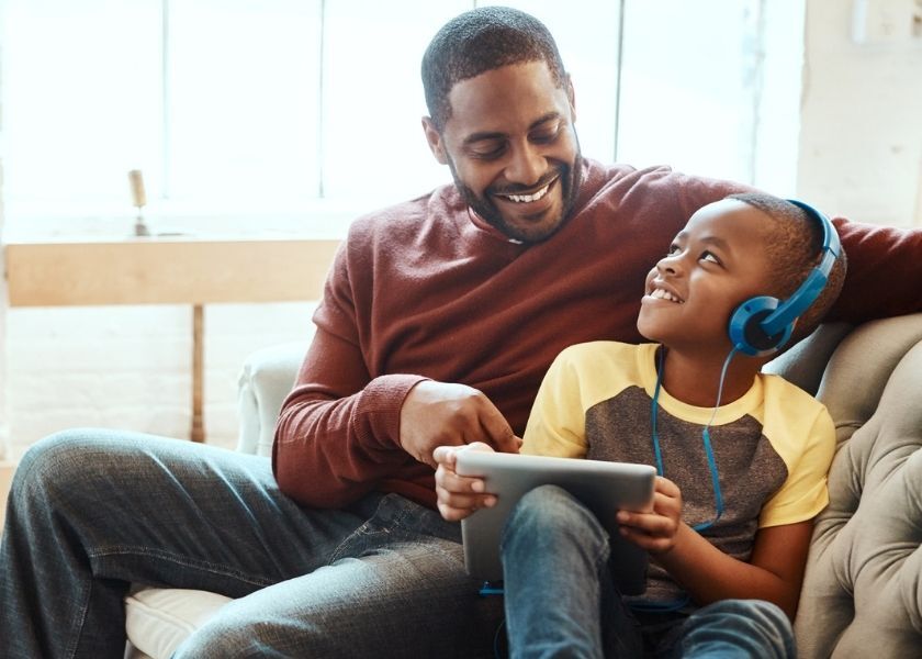 Father and son listening to Pinna