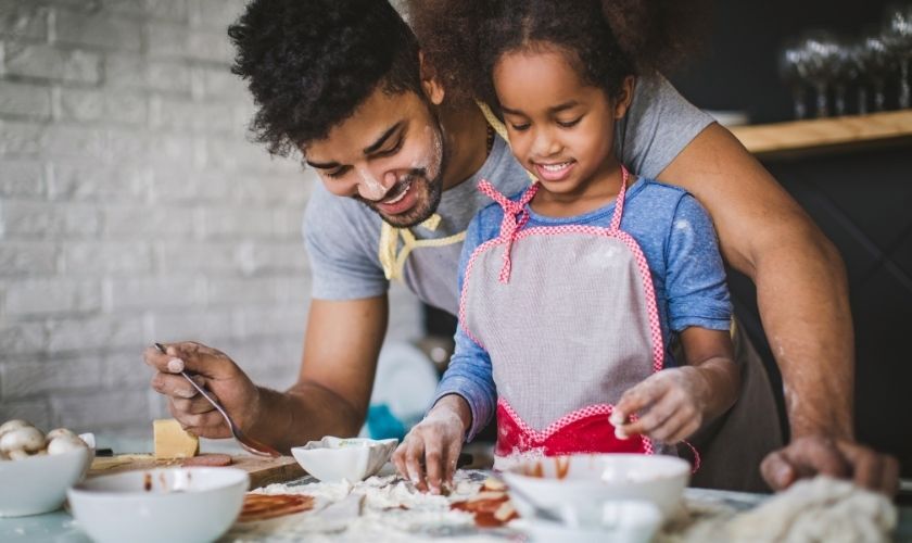 Father and daughter cooking